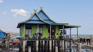 Wuring Fishing Village in Maumere, Flores, with traditional wooden stilt houses above the sea