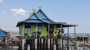 Wuring Fishing Village in Maumere, Flores, with traditional wooden stilt houses above the sea